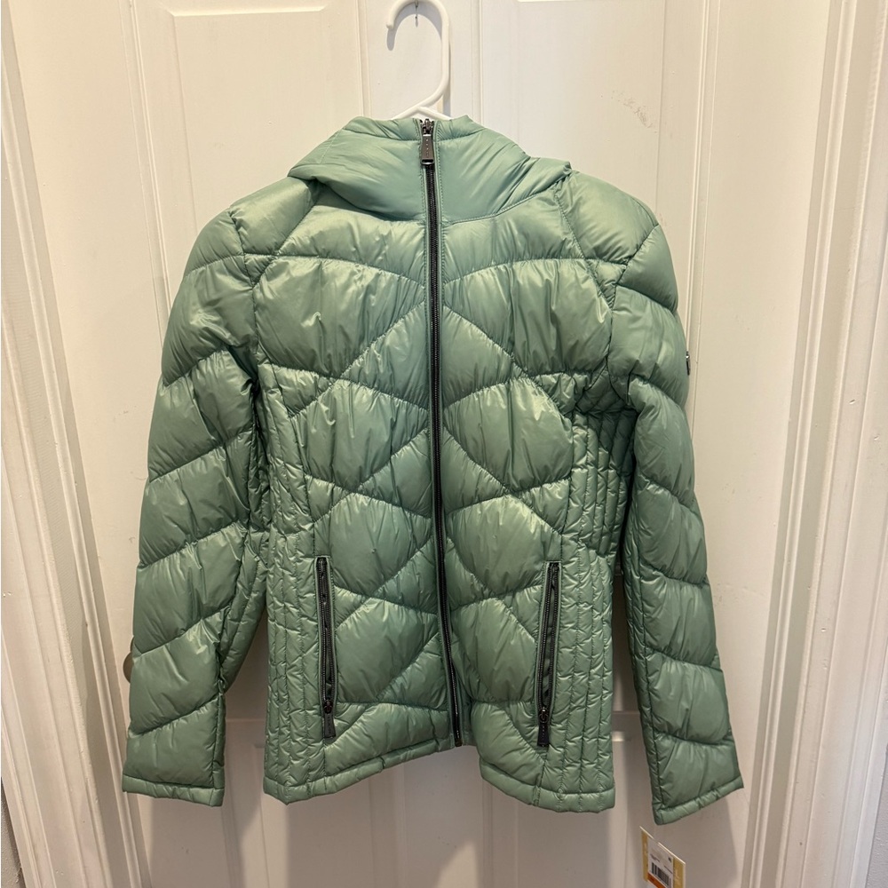 New with tags . Michael Kors lightweight muted mint green puffer . Adorable !